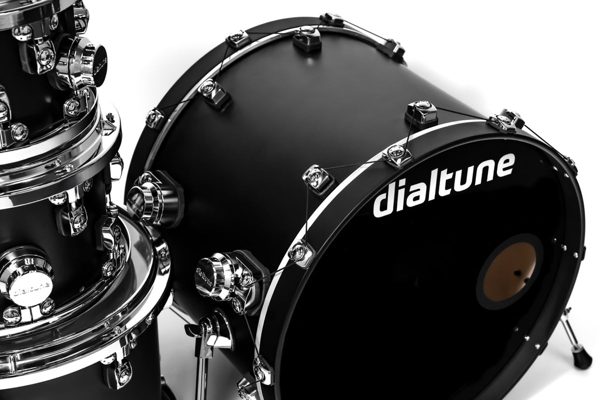 Black drum set with 'dialtune' branding on a white background