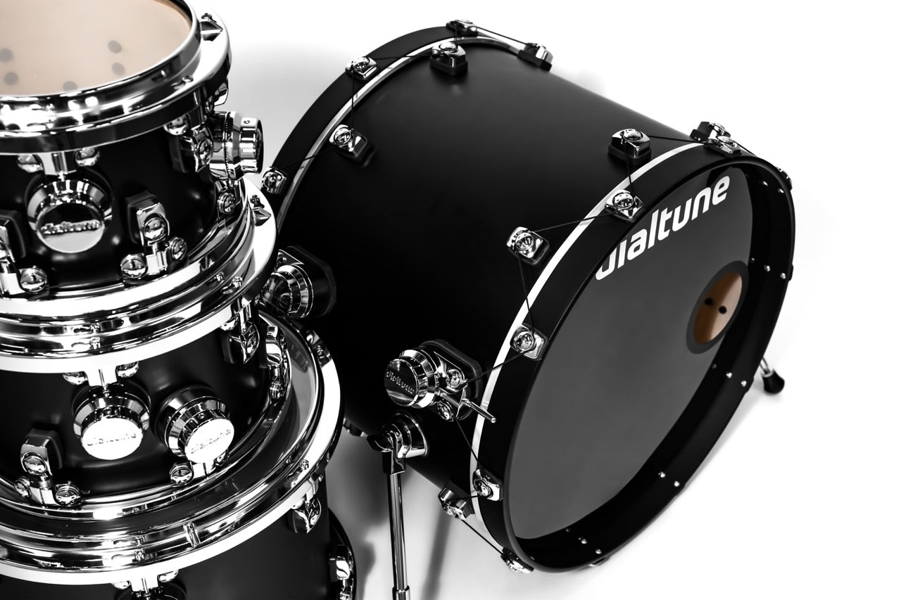 Drum set with black drum and chrome hardware on a white background